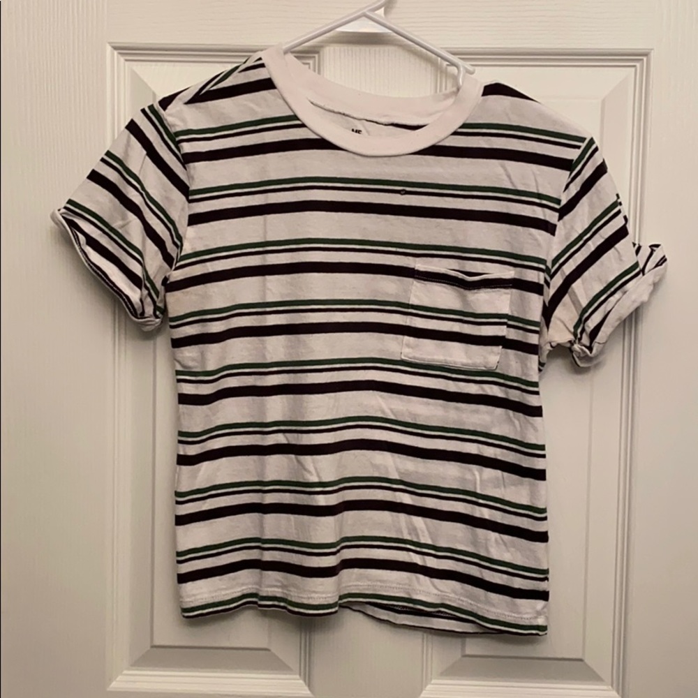 White t shirt with black and green stripes.